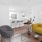 a living room with a couch and a table