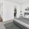 a bedroom with a bed and a mirror